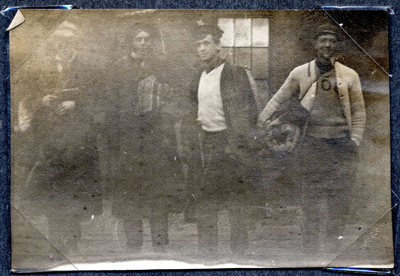 Photograph of four men setting out on a trip