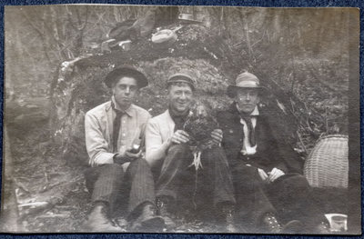 Photograph of three men on a hike