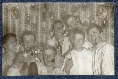 Photograph of  men drinking and smoking