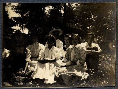 Photograph of a group sitting outside