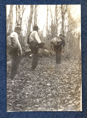 Photograph of three men hiking