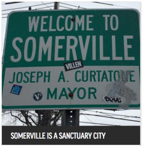 Sing that reads: Welcome to Somerville. Joseph A. Curtatone, Mayor. Somerville is a sanctuary city.